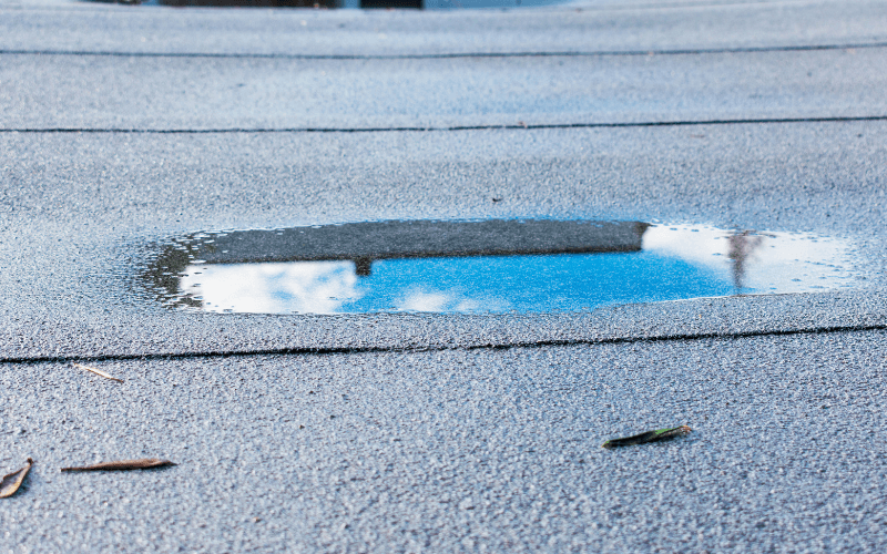 How to Safely and Effectively Drain Ponding Water on a Flat Industrial Roof