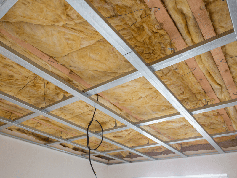 A room with an industrial roof insulation being fitted
