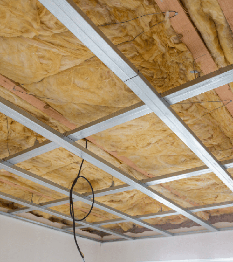 A room with an industrial roof insulation being fitted